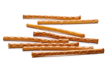 Salty cracker pretzel sticks isolated on white background