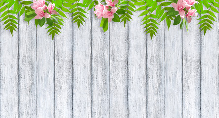 Holiday banner with magnolia flowers and foliage on background of shabby wooden planks