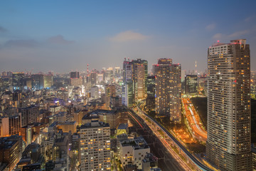 Fototapeta na wymiar Night view of Tokyo city with high building and expressway