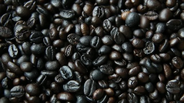 The  coffee roasted on wood close up image for background.
