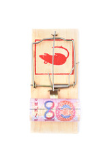 Roll of one hundred chinese yuan banknotes in a mousetrap isolated on white background