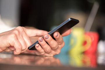 Woman's hands using a mobile phone