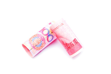 Rolls of one hundred  New Taiwan Dollar bill and chinese yuan banknotes  isolated on white background