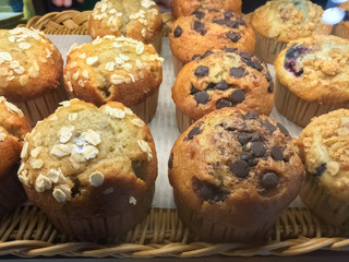 Close up muffins on a basket.