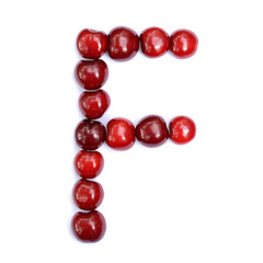 Letter F made with cherries to form a letter of the alphabet. Berry letters on a white background.