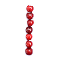 Letter I made with cherries to form a letter of the alphabet. Berry letters on a white background.