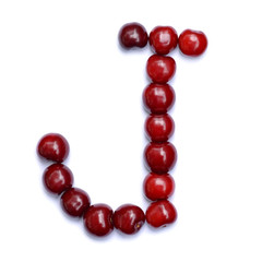 Letter J made with cherries to form a letter of the alphabet. Berry letters on a white background.