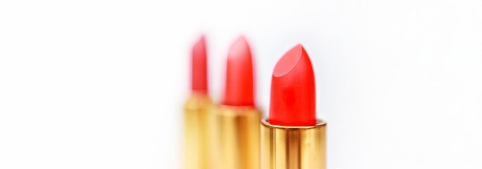 Obraz premium Set of colorful lipsticks for make up, top view, closeup, isolated, abstract, texture, on the white background
