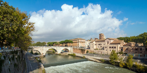 Fototapeta premium Rome, Italy. Morning panoramic view to the Ponte Fabricio and Tiber Island.