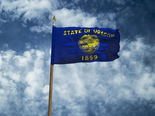 Oregon flag USA flag Silk waving flag made transparent fabric of Oregon US state with wooden flagpole gold spear on background sunny blue sky white smoke clouds real retro photo 3d illustration
