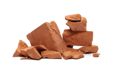 Shattered brick pieces isolated on white background