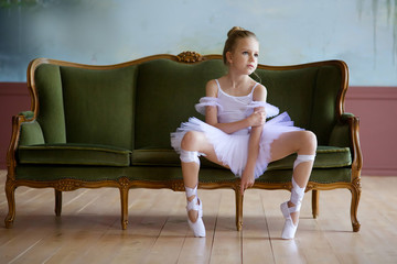 Little girl ballerina in white tutu