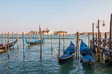 Fototapeta na wymiar Amazing view on the beautiful Venice, Italy. Many gondolas sailing down one of the canals.