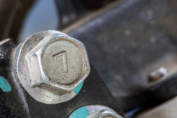 Close-up Screw heads number seven  black tone background