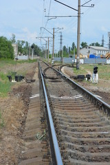 Fototapeta na wymiar Railway track with branching and white marking in front of it