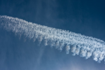 Blue sky with chemtrails or contrails