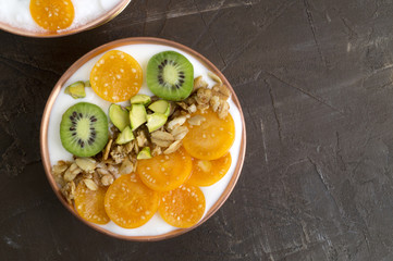 Natural homemade yogurt with ground-cherry on a wooden table.