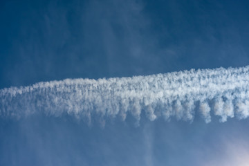 Blue sky with chemtrails or contrails