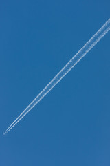 Blue sky with chemtrails or contrails