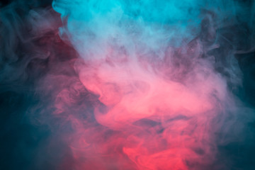 Obraz premium Colorful smoke on a black background closeup