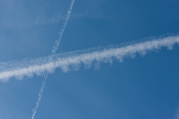 Blue sky with chemtrails or contrails