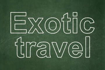 Obraz premium Vacation concept: text Exotic Travel on Green chalkboard background