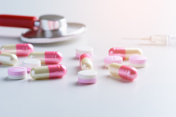 Prescription Medical, medicine stethoscope and pills, syringe, injection on white background. Health care or illness.