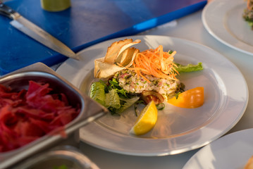 A salad from fish with vegetables