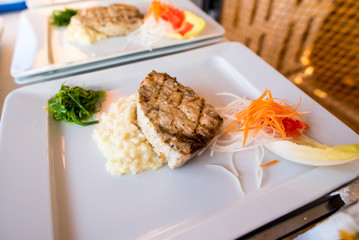 A fish steak dish with potatoes puree