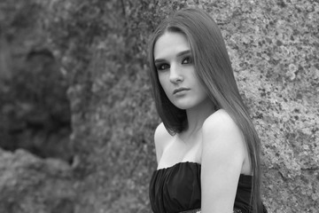 sad girl in a dress in black and white photo