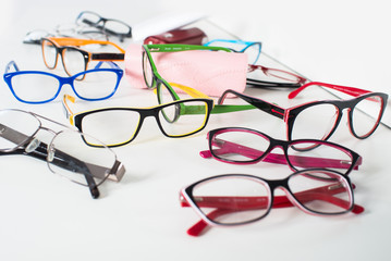 Set of many different colored glasses on white background
