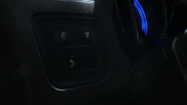 Slow motion car fuel tank control button pressing
