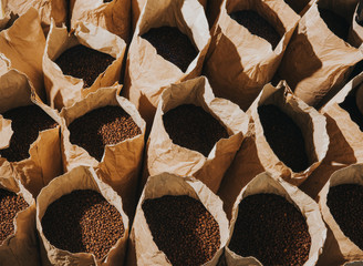 Craft paper bags with freshly roasted coffee beans