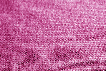 Knitting pattern with blur effect in pink color.