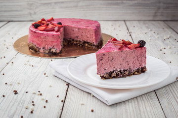 Strawberry Cake dessert with vanilla cream on wooden background