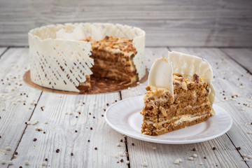 White Chocolate vegane cake with nuts and cream. Birthday concept