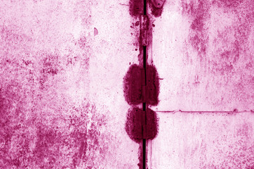 Grungy rusted metal surface in pink tone.