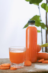 Fresh natural carrot juice on table. Healthy drink.