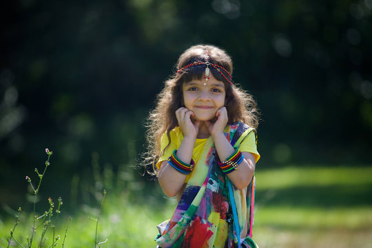 Little baby girl, dressed in a Sari of Indian culture.