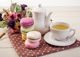 french colorful macarons on a wooden floor