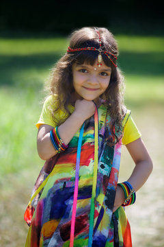 Little baby girl, dressed in a Sari of Indian culture.