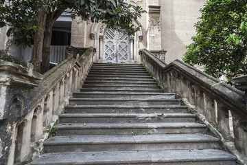 Fototapeta na wymiar Street view, stone stairs to ancient church in El Raval quarter in historic center of Barcelona.Spain.