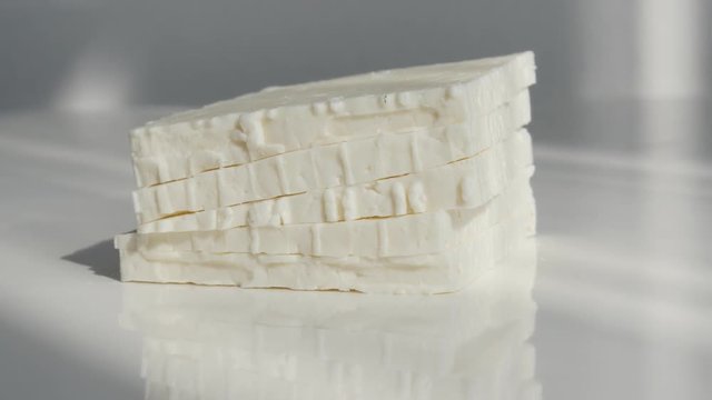 Stacked cow milk cheese pieces 4K footage