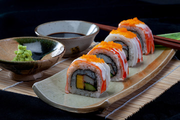 close up of sashimi sushi set with chopsticks and soy