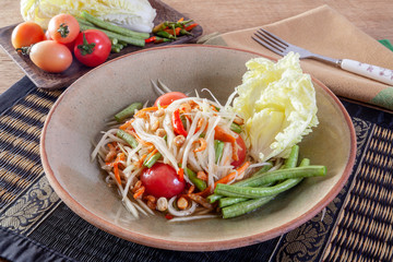 Thai papaya salad or Som Tum Isolated on the white background