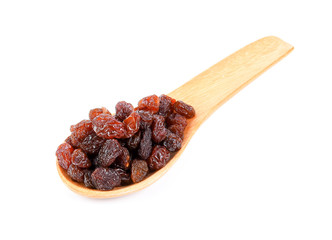 raisin on wood spoon isolated on white background