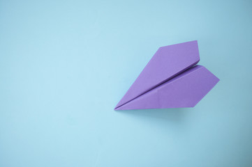 Paper plane on colorful background.
