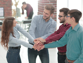 Group of people hands together partnership teamwork.