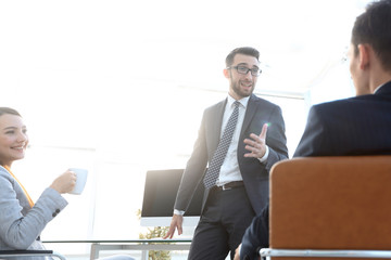 members of the business team talking in the office
