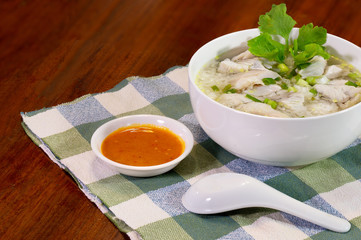 Boiled rice with sea bass in white bowl delicious food for thai breakfast.Boiled rice with sea bass in white bowl delicious food for thai breakfast